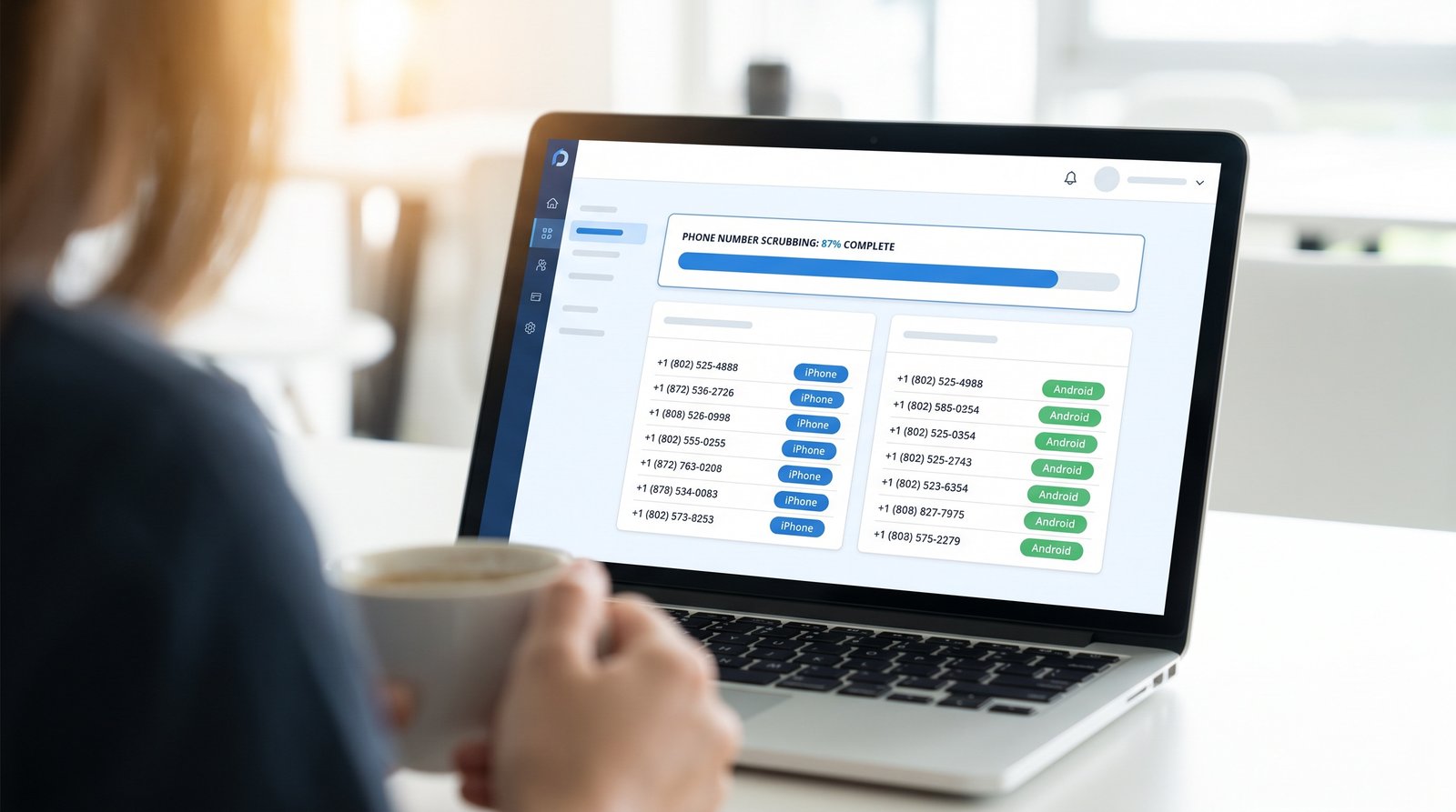 iBlueText dashboard scrubbing a phone list and tagging each number as iPhone or Android